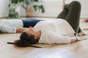 photo of a woman in a trauma sensitive yoga class in auckland