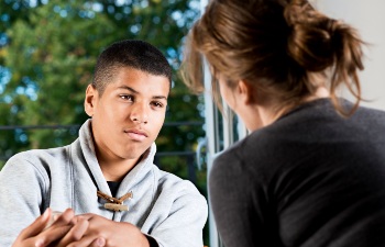 photo of a teenage boy having counsellling