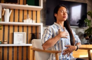 photo of client tuning into her body in a somatic therapy session